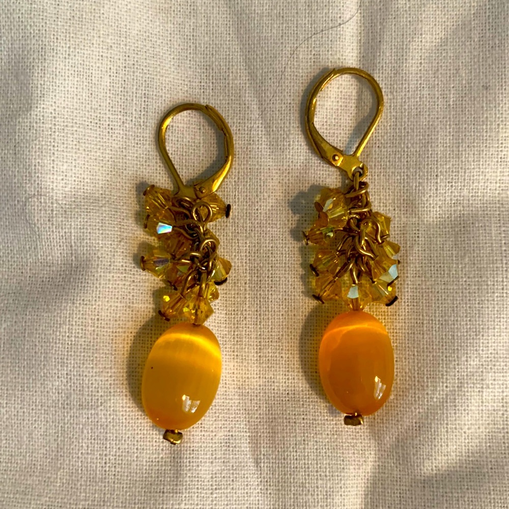 Yellow stone and crystal dangling earrings.